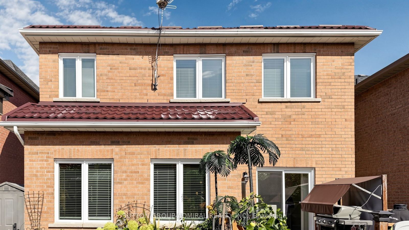 Rear elevation showing the galvanized metal roof